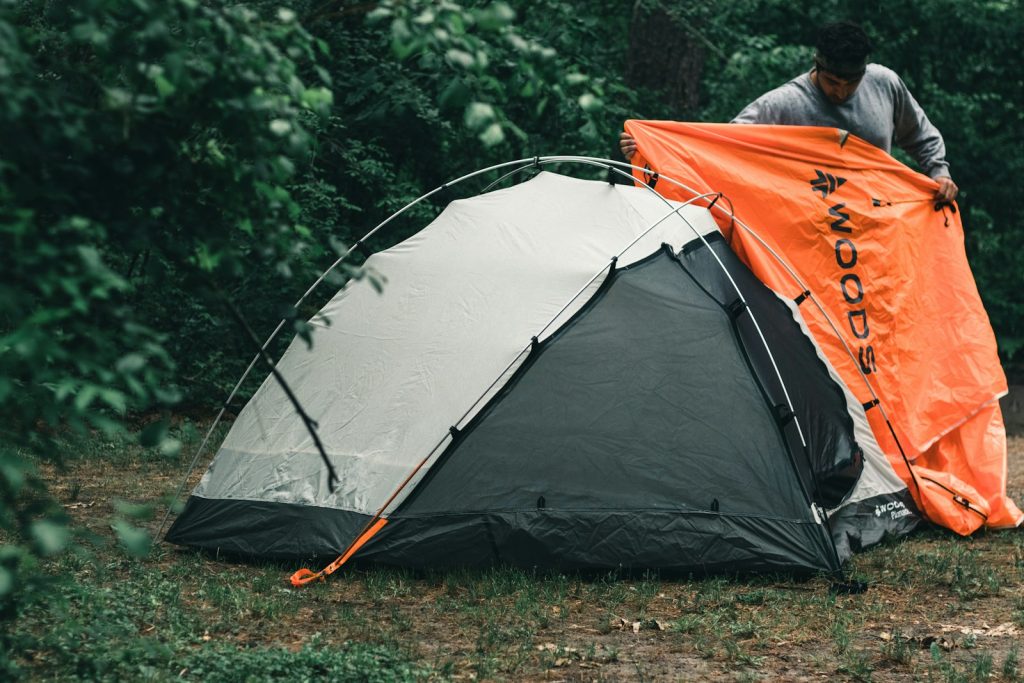Forest Safety: How to Protect Your Campsite from Insects and Wildlife orange and gray tent on green grass field during daytime
