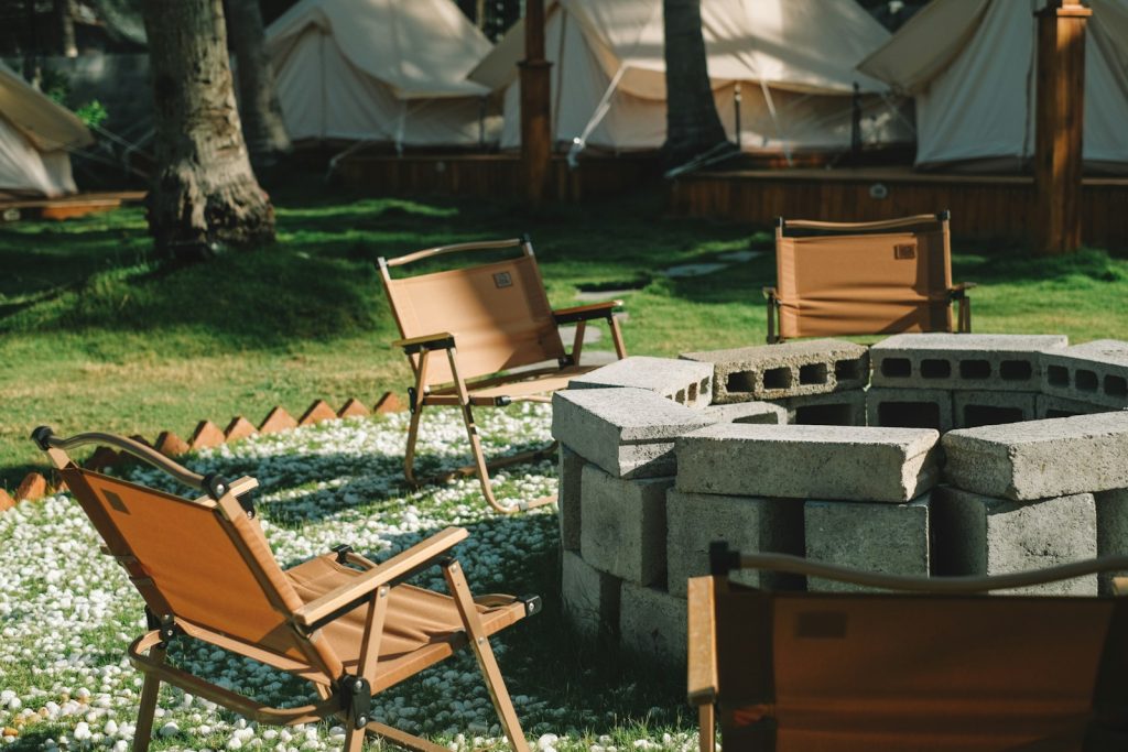 Best Camping Chairs for Every Budget: From Affordable to Premium a fire pit sitting in the middle of a field