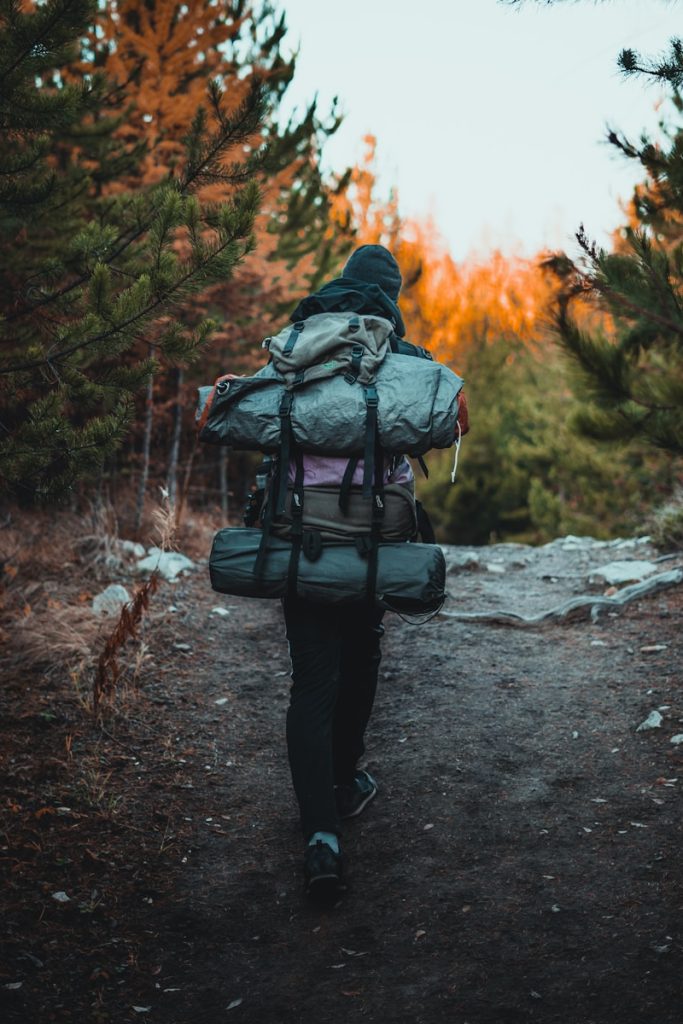 woman wearing hiking bags