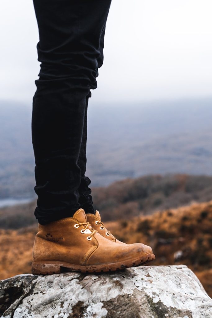 person standing on rock