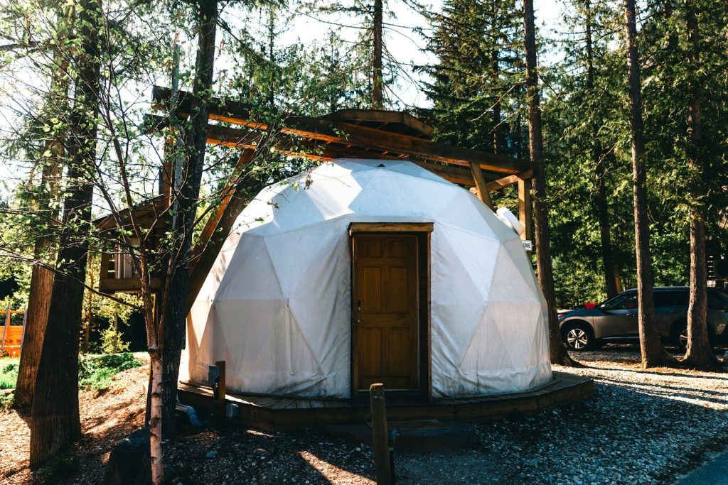 Geodesic dome glamping tent in a forest setting