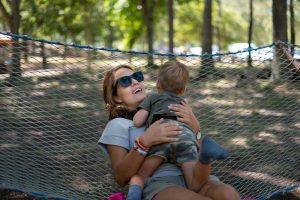 a woman holding a baby